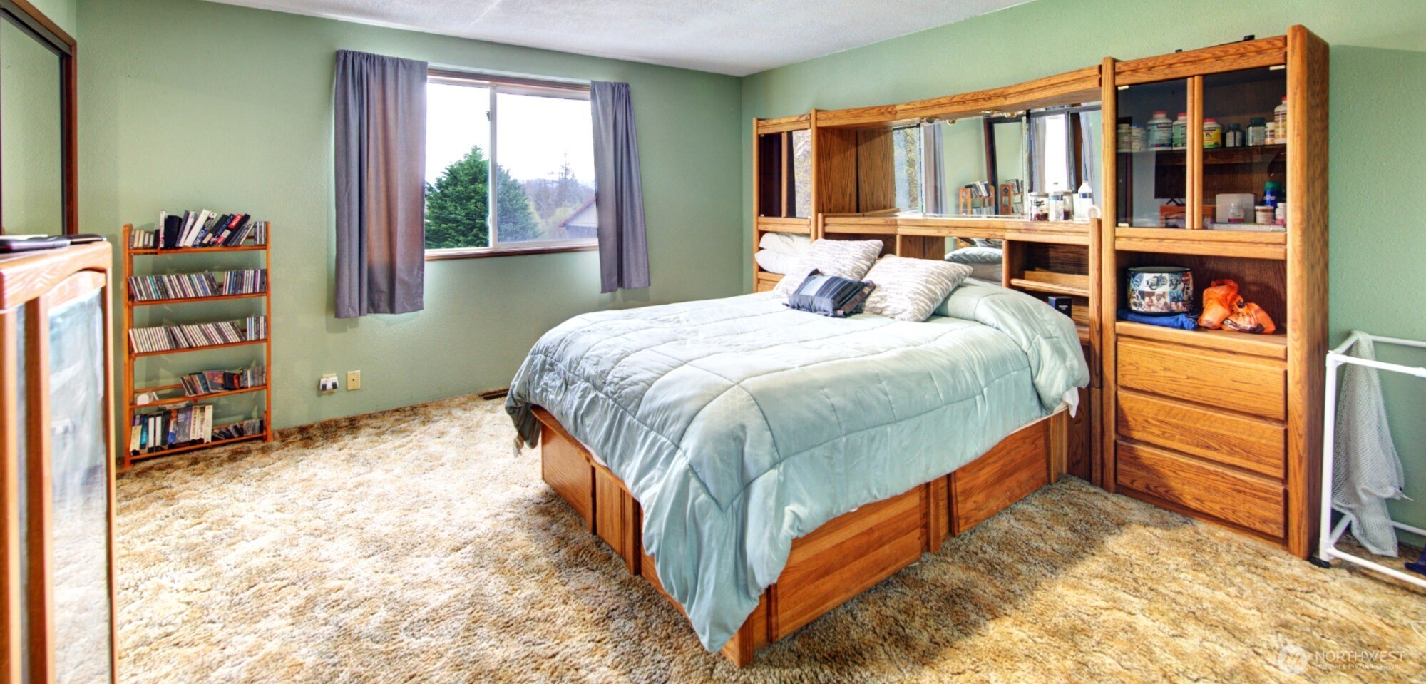 15714 Forty Five Road Arlington, WA 98223 - Photo 15 of 40 a bed sitting in a bedroom next to a window