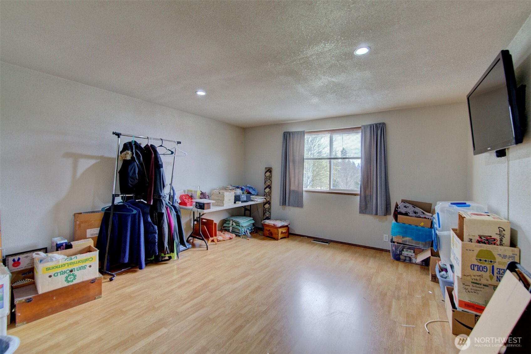 15714 Forty Five Road Arlington, WA 98223 - Photo 18 of 40 a living room with furniture and a flat screen tv