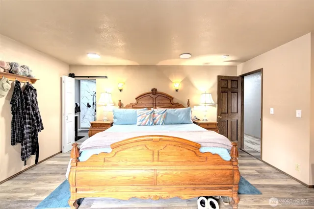 a spacious bedroom with a bed and a table