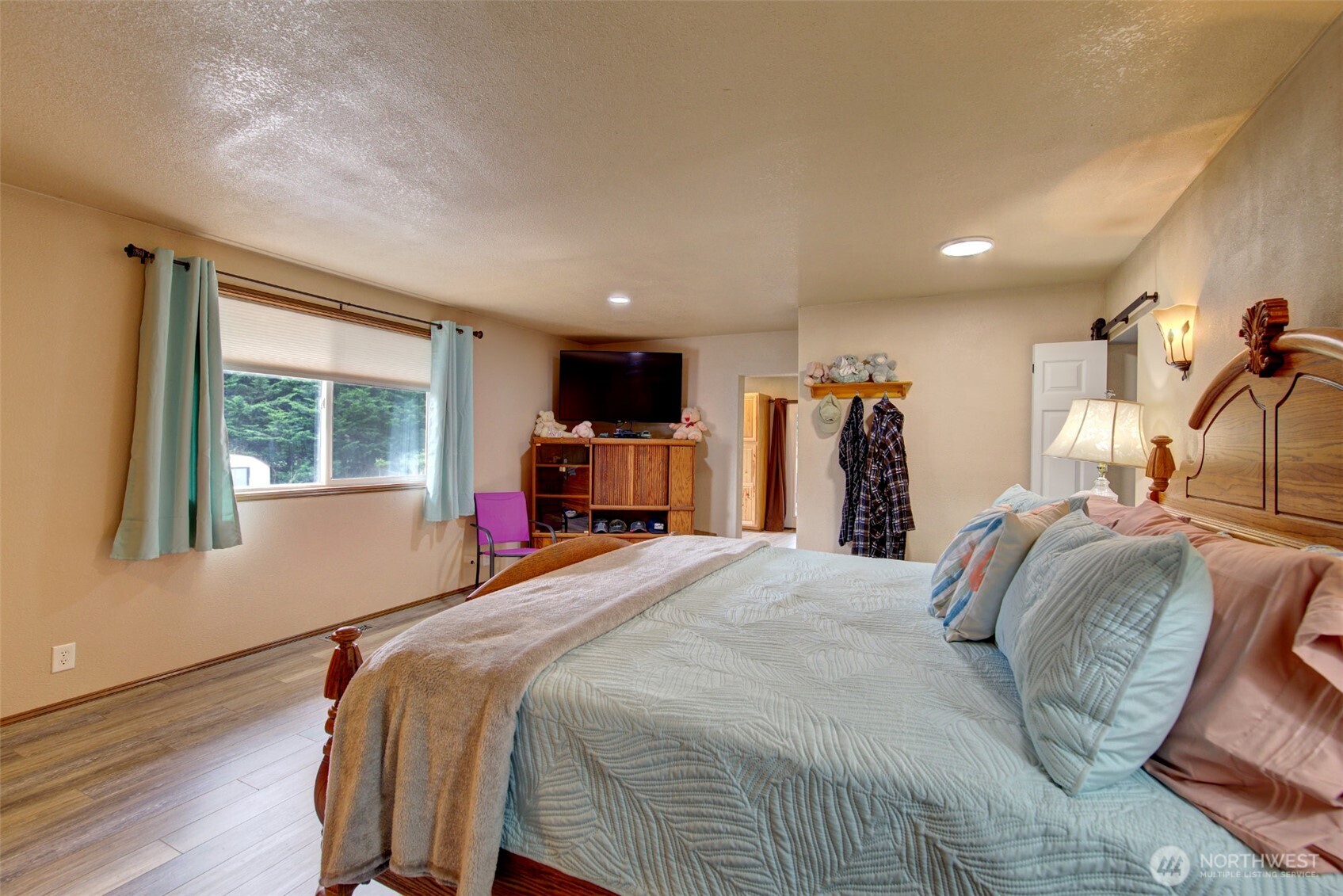 15714 Forty Five Road Arlington, WA 98223 - Photo 21 of 40 a bed room with a bed and a window