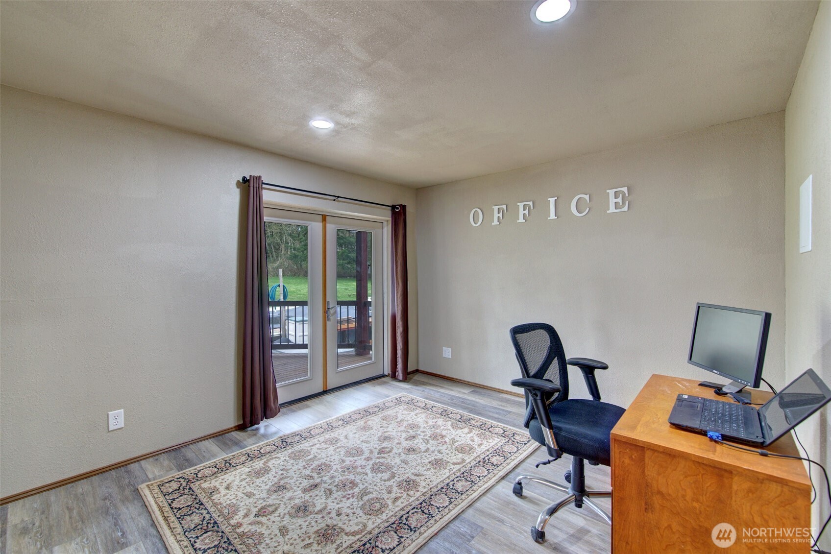15714 Forty Five Road Arlington, WA 98223 - Photo 23 of 40 a view of workspace filled with furniture and rug