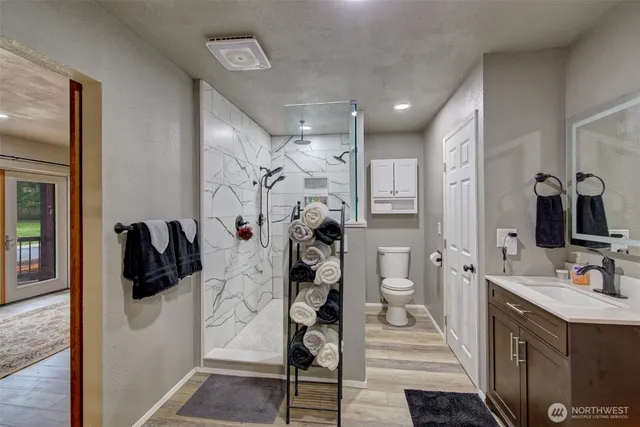 a walk in closet with a mirror