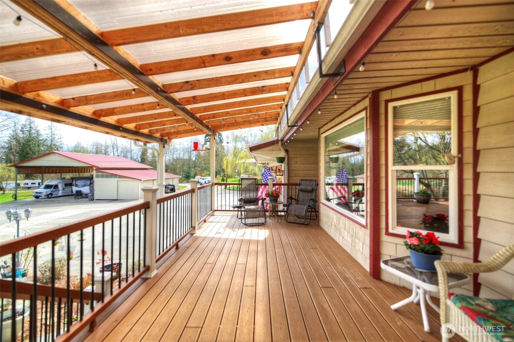 15714 Forty Five Road Arlington, WA 98223 - Photo 3 of 40 a view of a porch with wooden floor and furniture