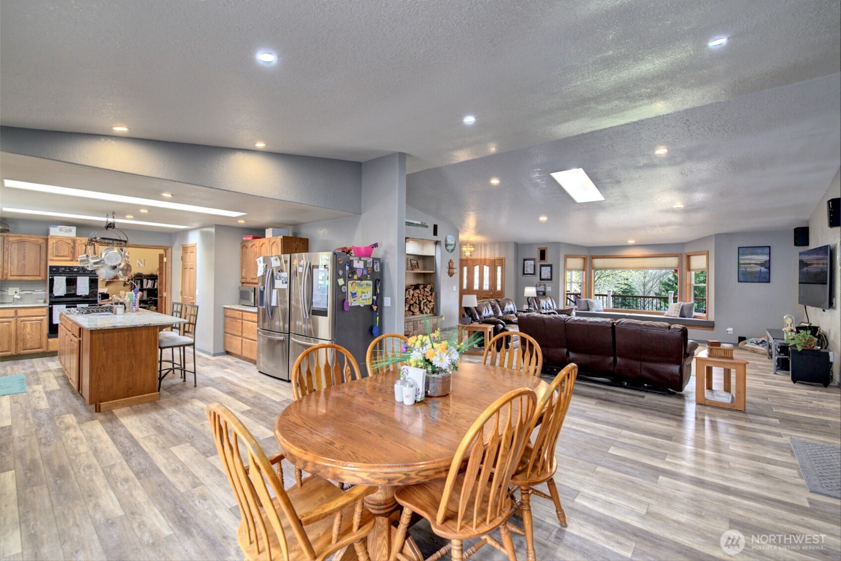 15714 Forty Five Road Arlington, WA 98223 - Photo 9 of 40 a view of a dining area with furniture and wooden floor