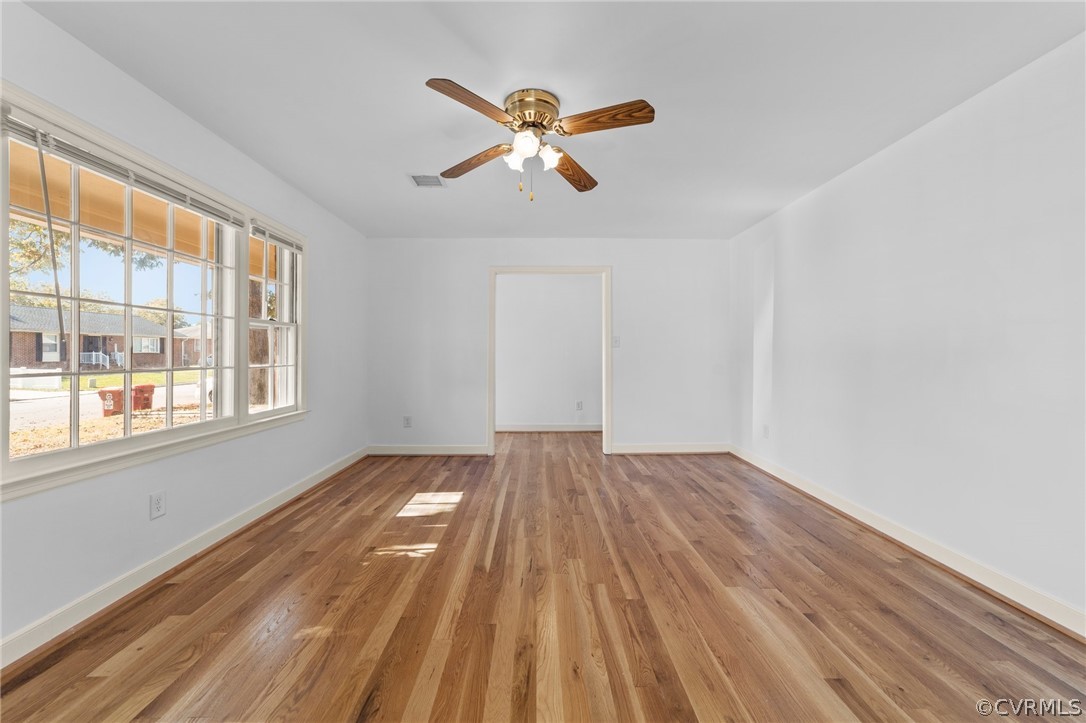 910 Jamestown Road Colonial Heights, VA 23834 - Photo 4 of 28 a view of an empty room with wooden floor and a window