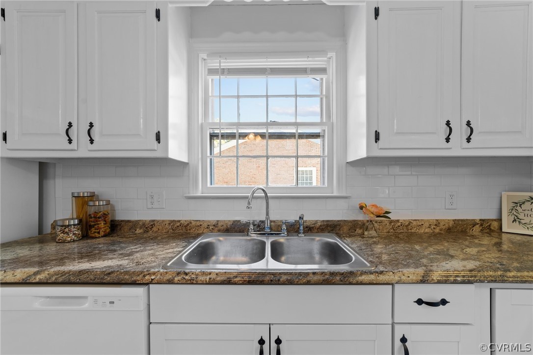 910 Jamestown Road Colonial Heights, VA 23834 - Photo 8 of 28 a kitchen with granite countertop a sink a window and cabinets