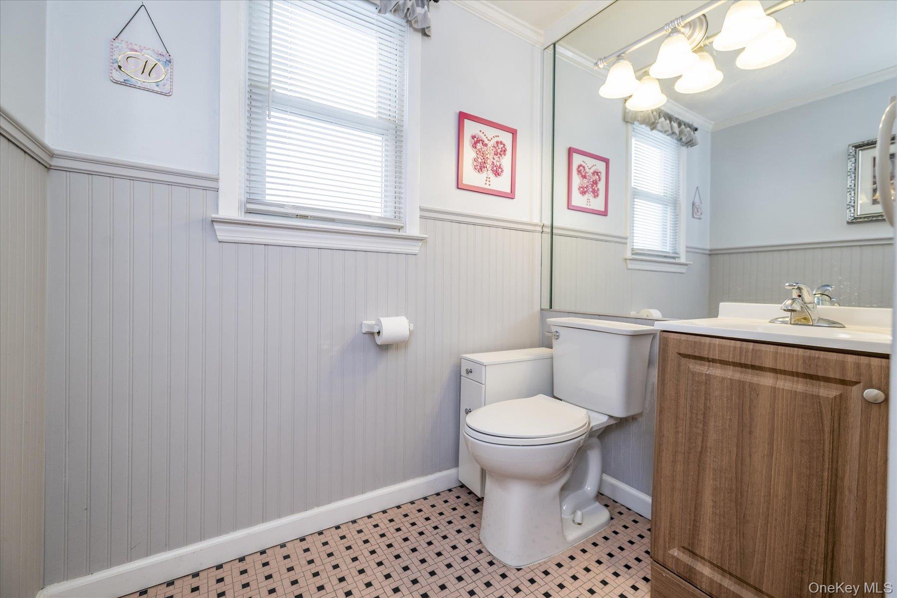 158 Roosevelt Avenue Freeport, NY 11520 - Photo 12 of 30 a bathroom with a sink toilet and window