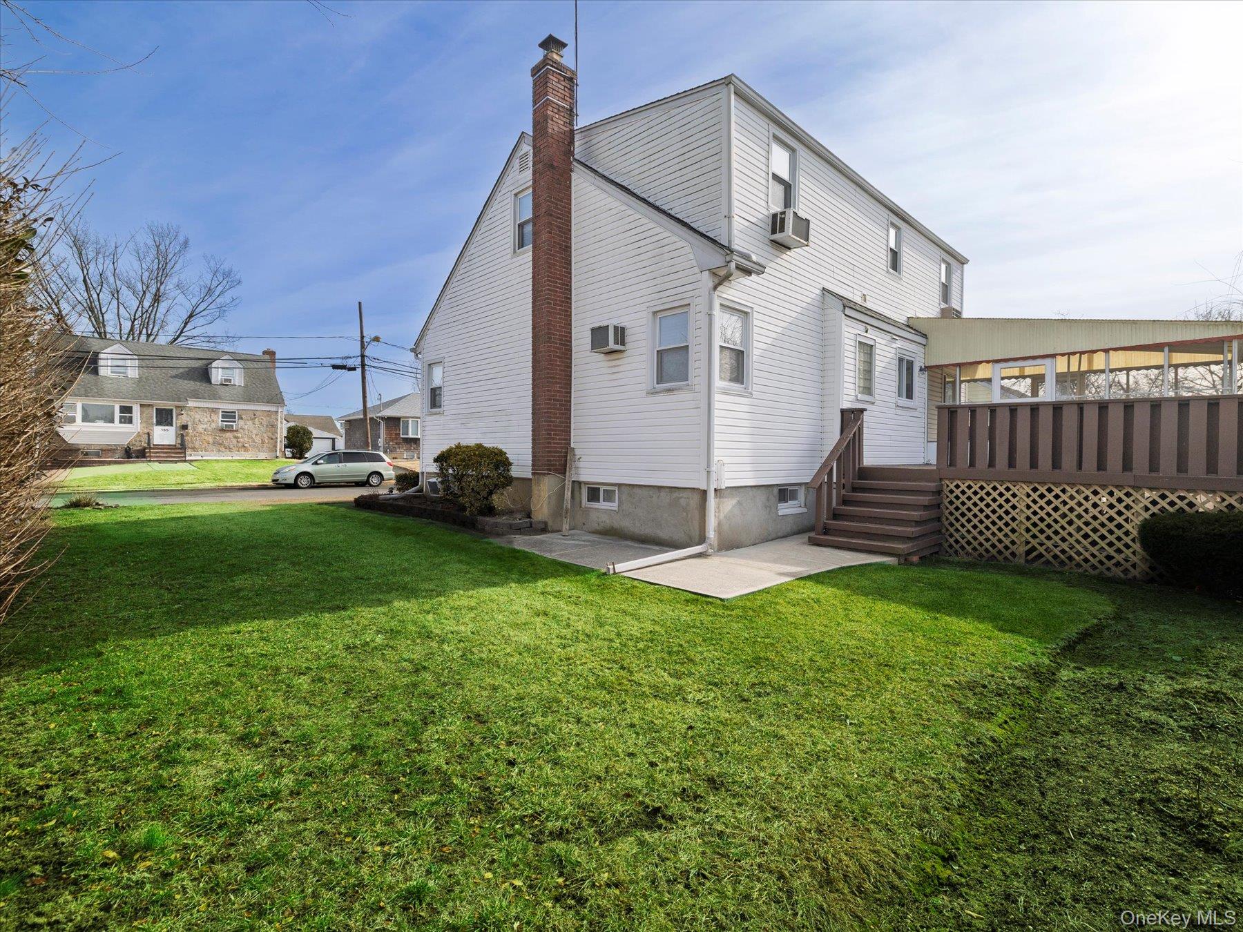 158 Roosevelt Avenue Freeport, NY 11520 - Photo 17 of 30 a view of a house with a yard