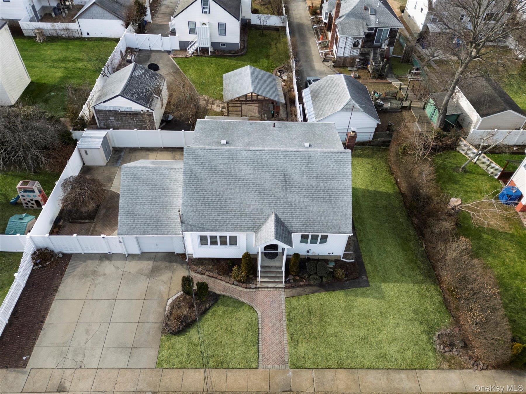 158 Roosevelt Avenue Freeport, NY 11520 - Photo 24 of 30 an aerial view of residential houses with outdoor space and parking