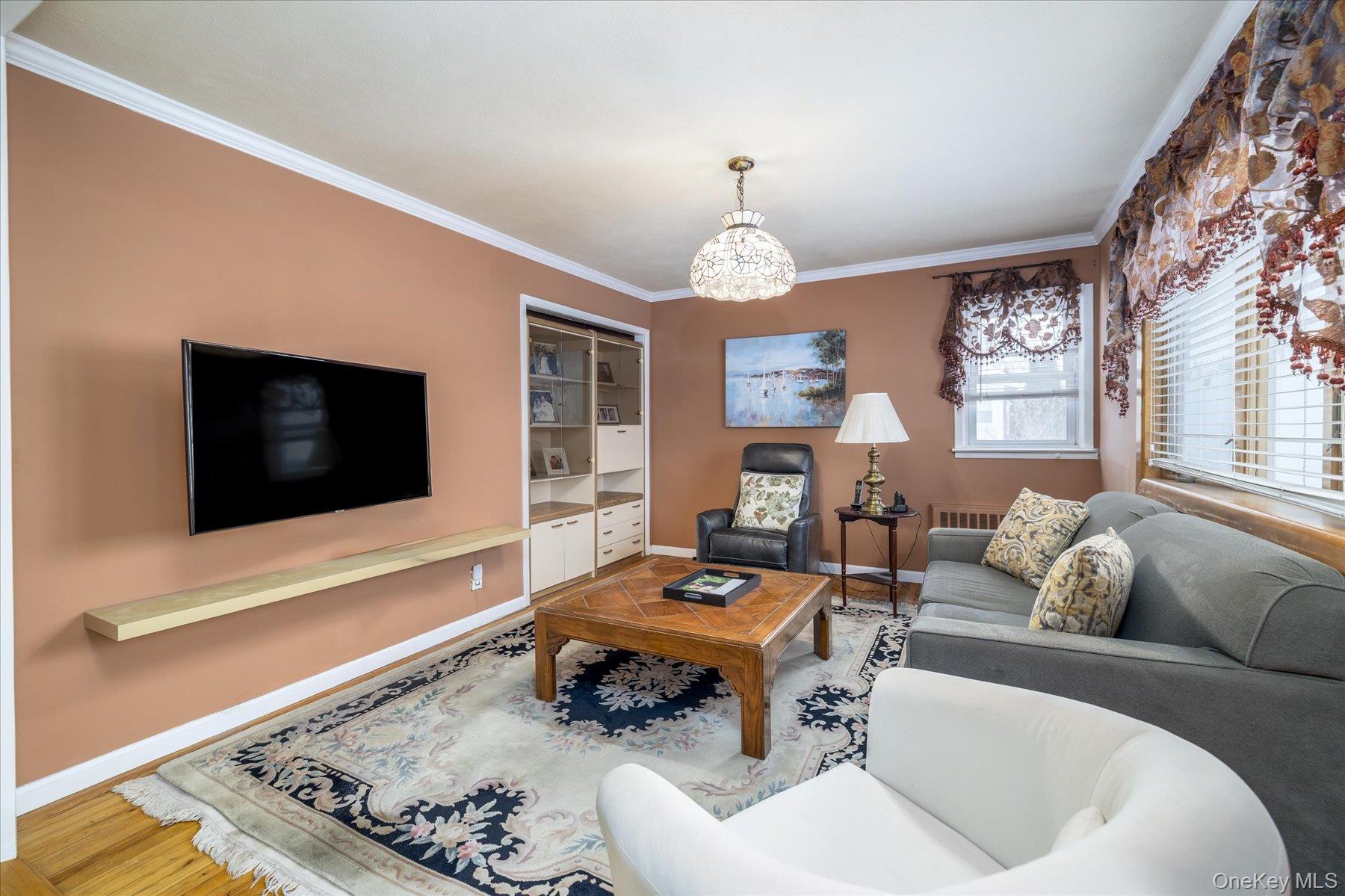 158 Roosevelt Avenue Freeport, NY 11520 - Photo 3 of 30 a living room with furniture and a flat screen tv