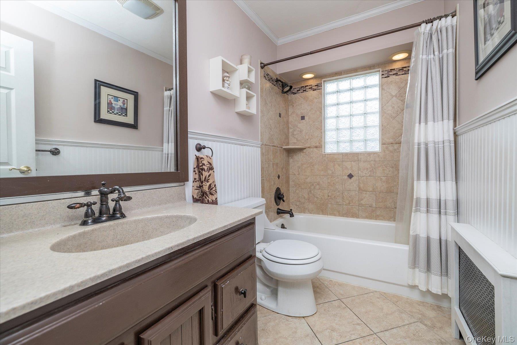 158 Roosevelt Avenue Freeport, NY 11520 - Photo 8 of 30 a bathroom with a sink toilet tub and shower