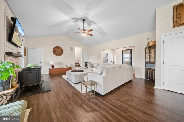 a spacious bathroom with a double vanity sink a mirror and a shower