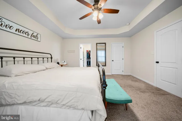 a bedroom with a bed and cabinets