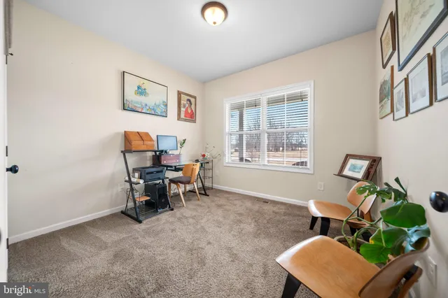 a bathroom with a sink toilet and a mirror