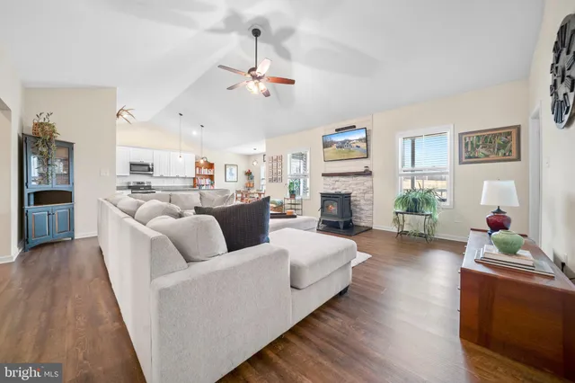 a spacious bedroom with a bed and a chandelier