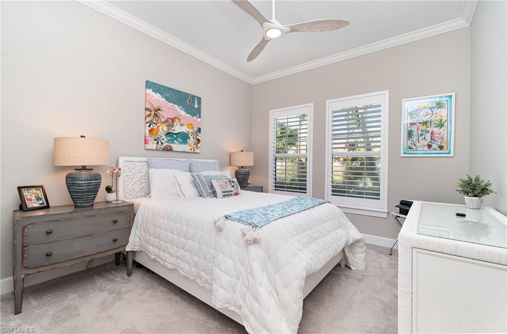 9536 Montelanico Loop Naples, FL 34119 - Photo 14 of 24 a bedroom with a bed and a window