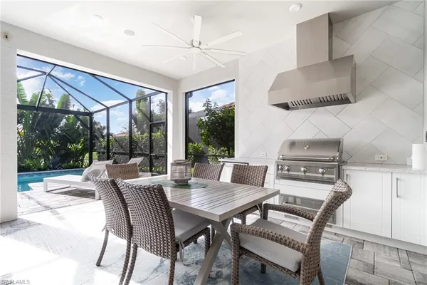 a view of a dining room with furniture window and outside view
