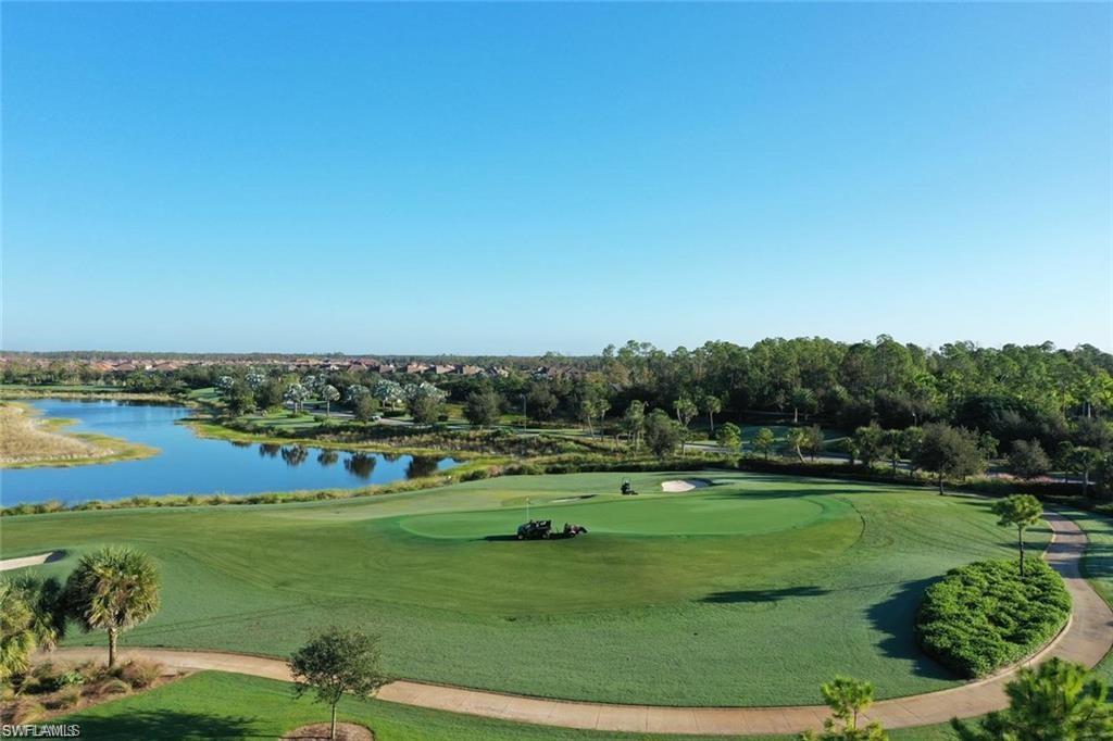9536 Montelanico Loop Naples, FL 34119 - Photo 20 of 24 a view of a golf course with a lake view