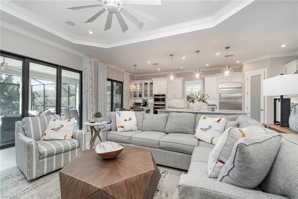 9536 Montelanico Loop Naples, FL 34119 - Photo 3 of 24 a living room with furniture and a large window