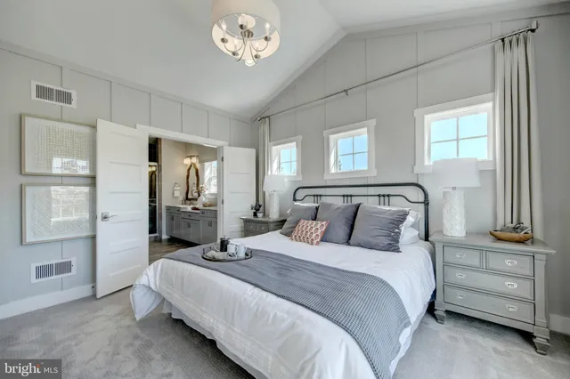 a bedroom with a bed and a cabinets