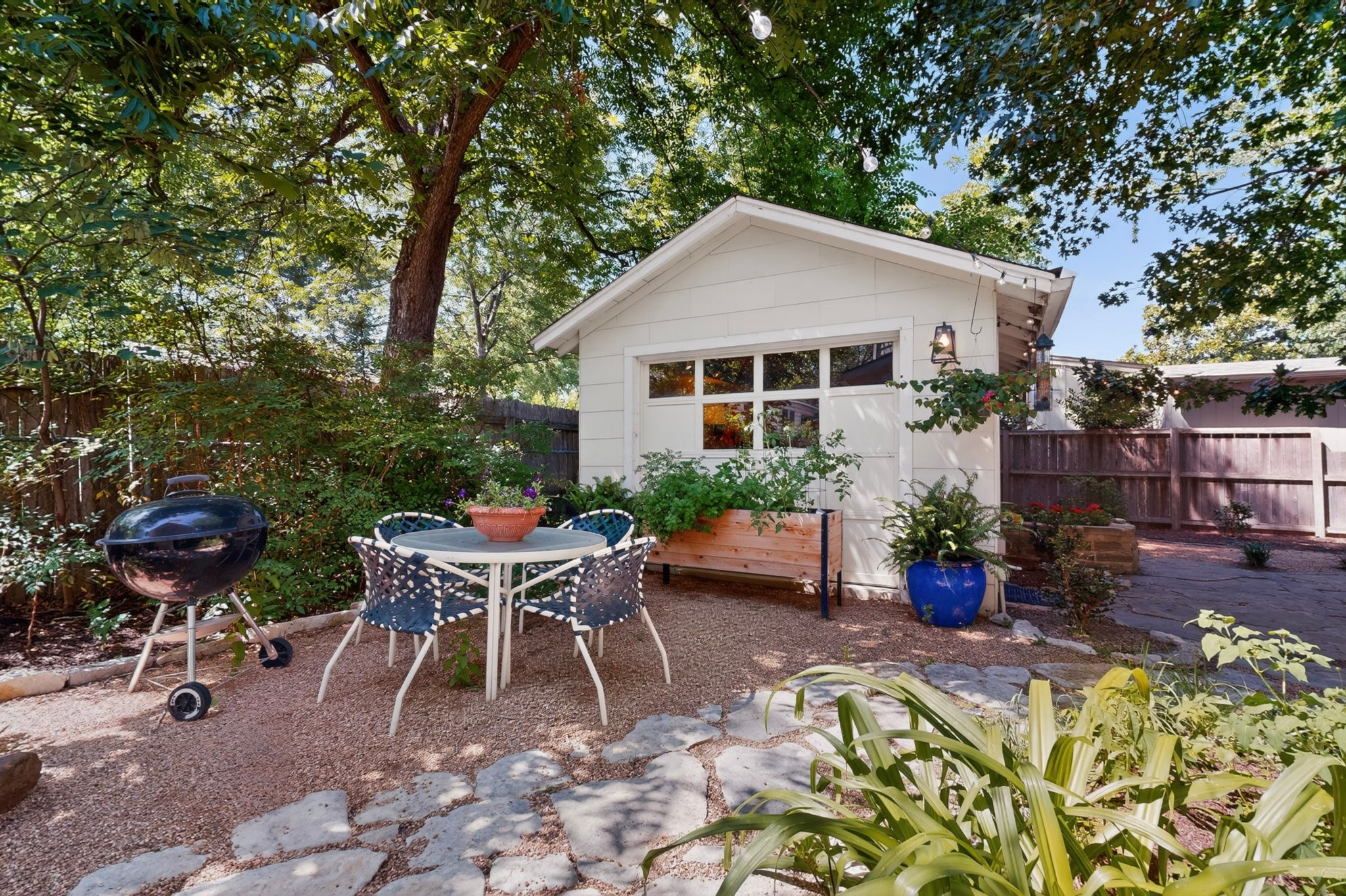 1906 Collier Street Austin, TX 78704 - Photo 28 of 40 A private backyard oasis features a dedicated patio, perfect for outdoor dining and entertaining.