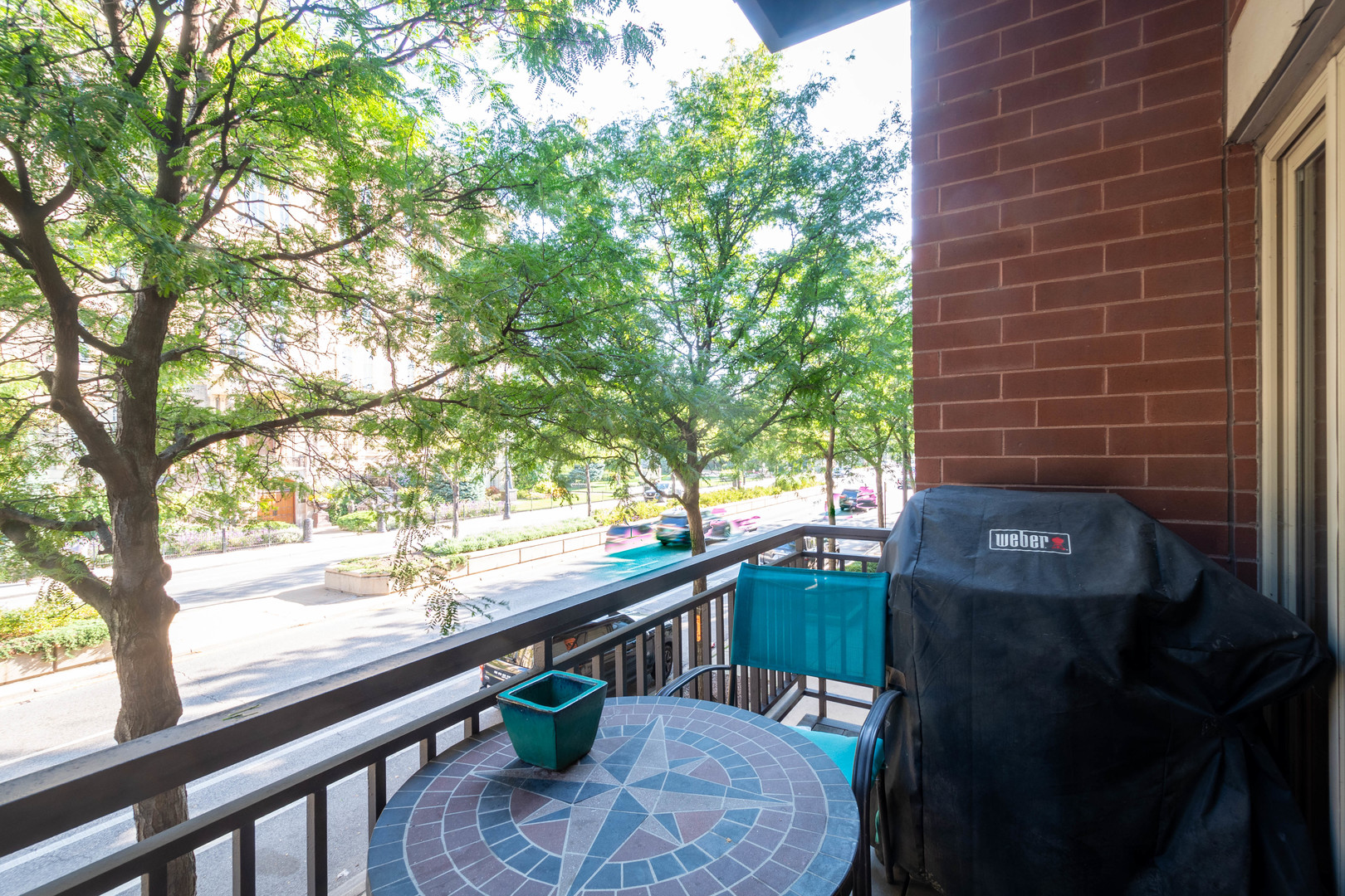 1075 West Roosevelt Road, Unit 201 Chicago, IL 60608 - Photo 17 of 21 a view of balcony with two chairs and a table