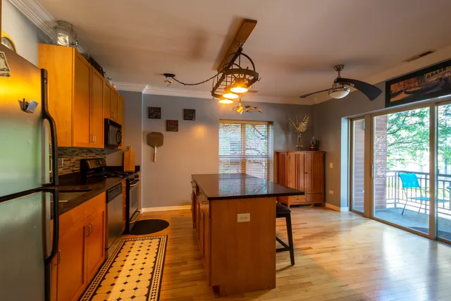 a view of a kitchen with furniture and a window