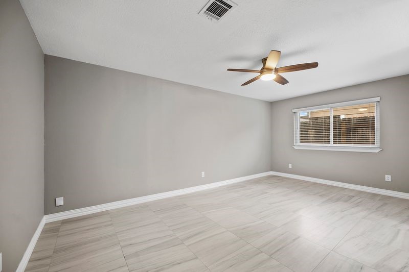 16519 Gaeldom Drive Houston, TX 77084 - Photo 13 of 28 a view of an empty room with a window