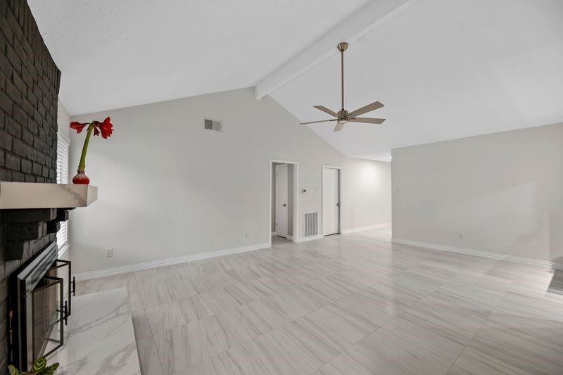 16519 Gaeldom Drive Houston, TX 77084 - Photo 14 of 28 a view of a room with a ceiling fan and window
