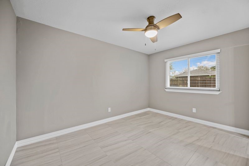 16519 Gaeldom Drive Houston, TX 77084 - Photo 16 of 28 a view of a big room with wooden floor and windows