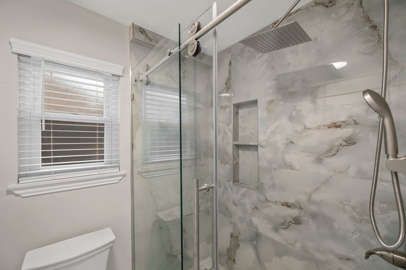 16519 Gaeldom Drive Houston, TX 77084 - Photo 20 of 28 a bathroom with a shower and toilet
