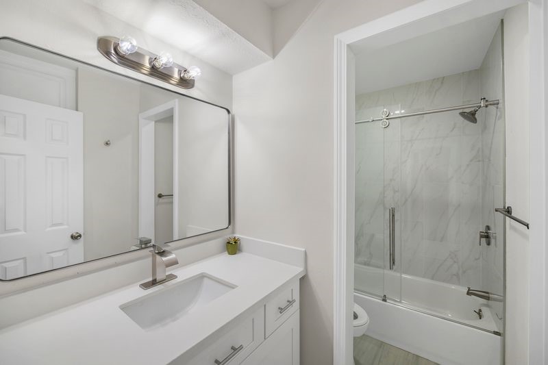 16519 Gaeldom Drive Houston, TX 77084 - Photo 21 of 28 a bathroom with a double vanity sink mirror and shower