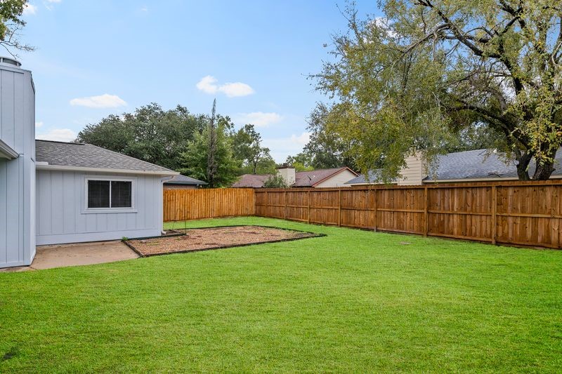 16519 Gaeldom Drive Houston, TX 77084 - Photo 25 of 28 a view of a backyard with a garden