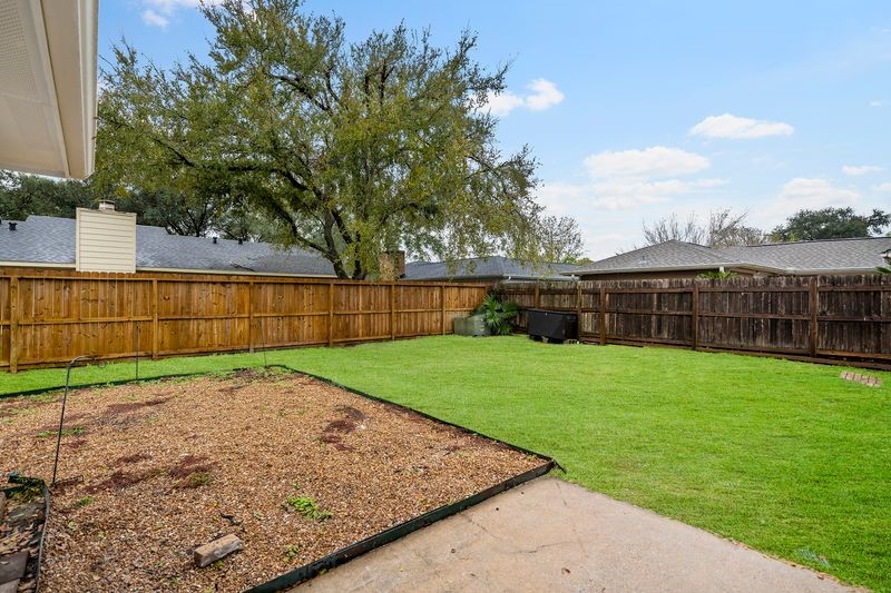 16519 Gaeldom Drive Houston, TX 77084 - Photo 26 of 28 a view of a backyard with a garden