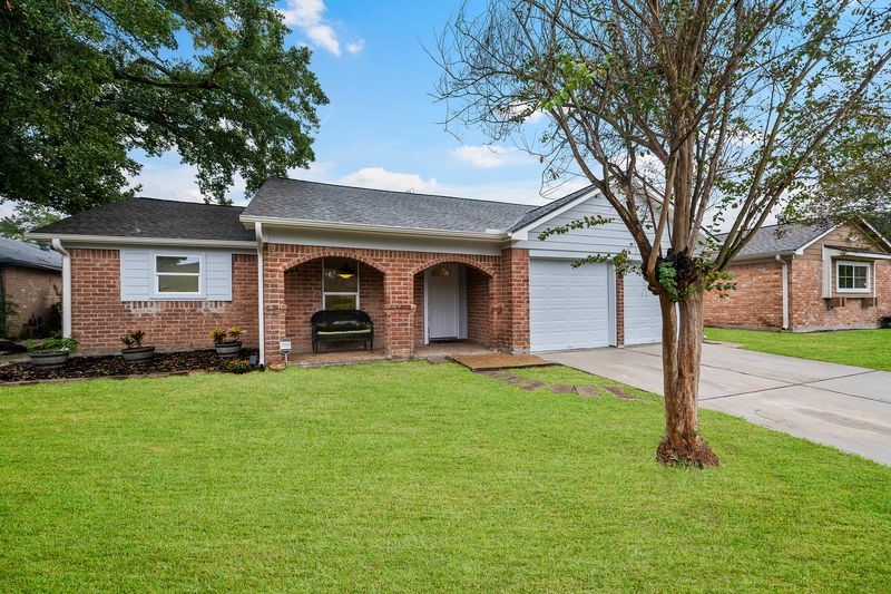 16519 Gaeldom Drive Houston, TX 77084 - Photo 3 of 28 a front view of a house with yard and green space
