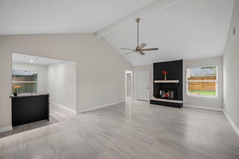 16519 Gaeldom Drive Houston, TX 77084 - Photo 9 of 28 a view of an empty room with a window and fireplace