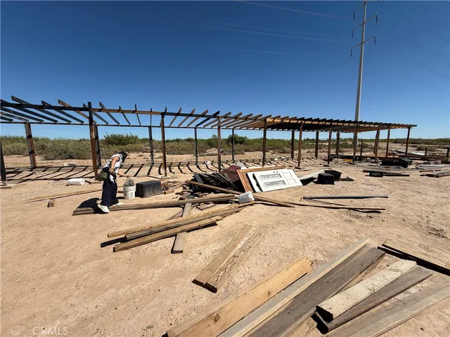 a view of a swimming pool with furniture