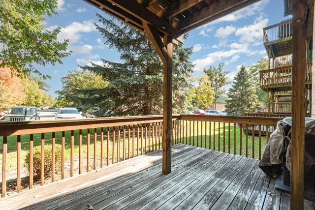 a view of balcony with wooden floor