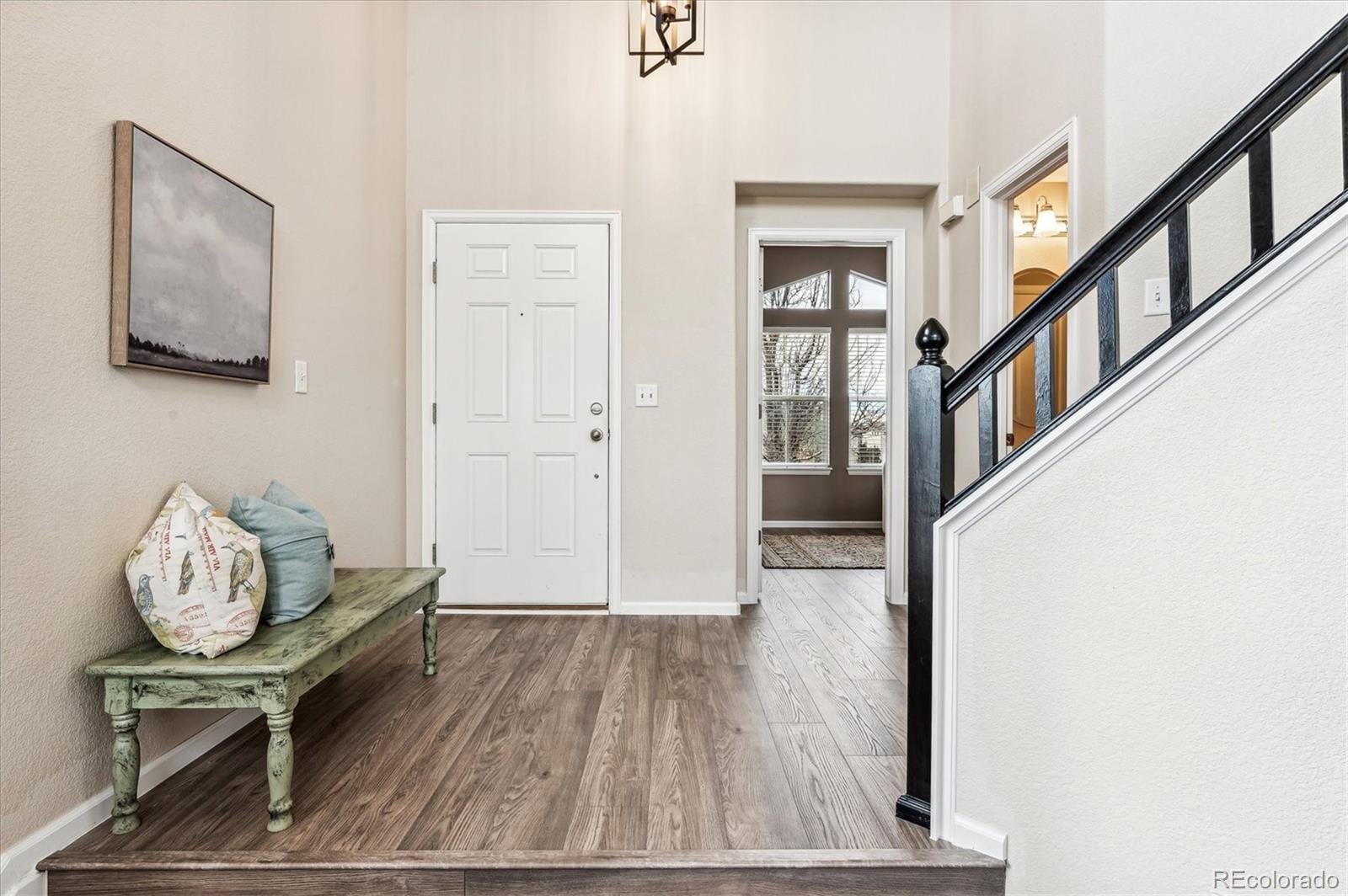 10904 Brooklawn Road Highlands Ranch, CO 80130 - Photo 4 of 50 a view of entryway with wooden floor