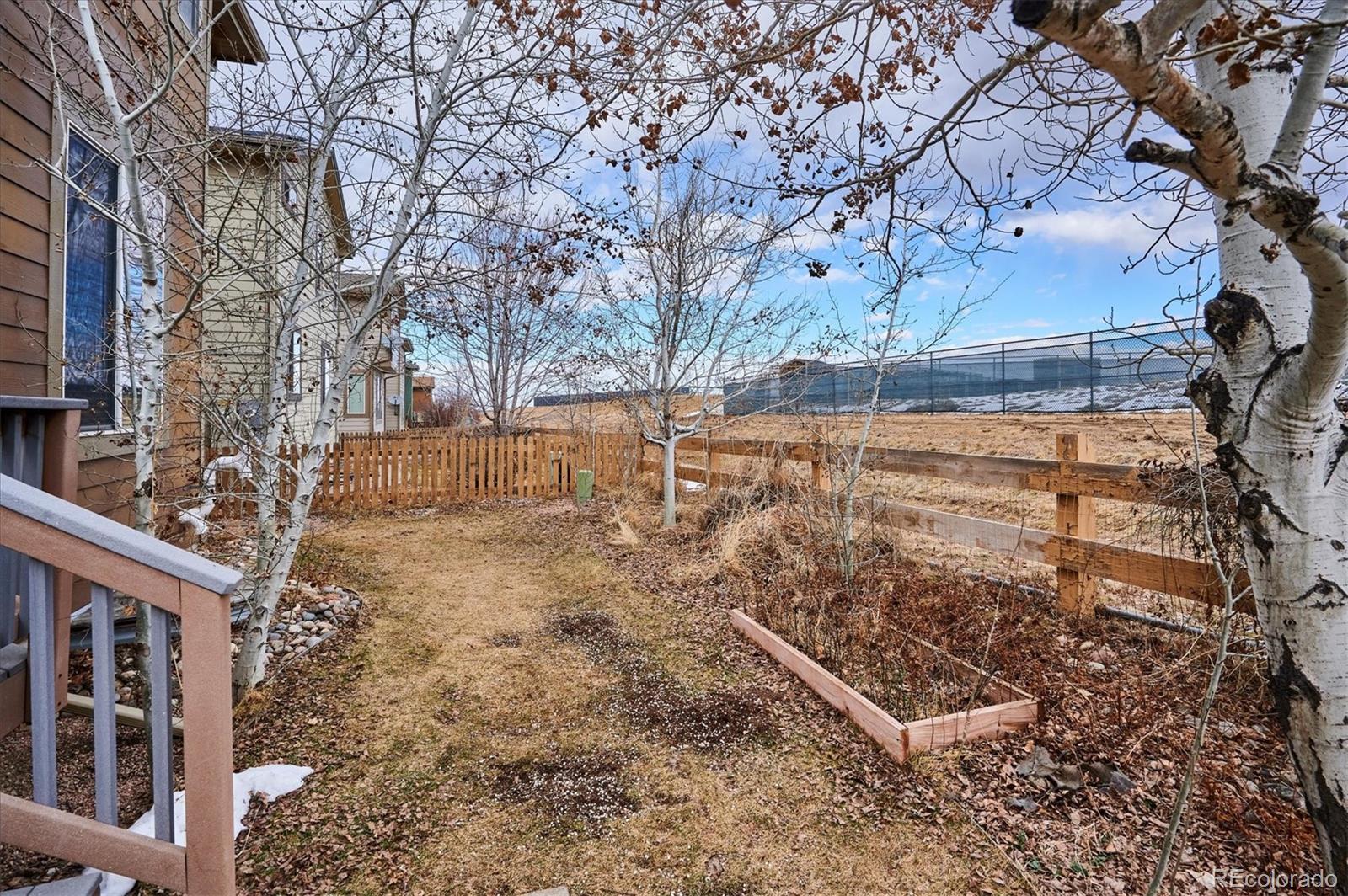 10904 Brooklawn Road Highlands Ranch, CO 80130 - Photo 42 of 50 a view of yard with wooden fence