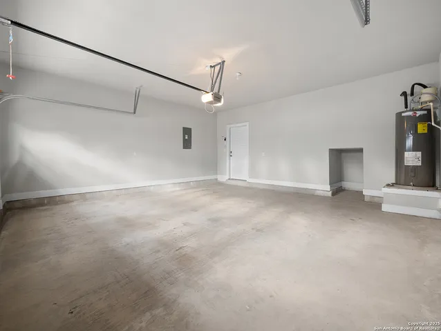 a view of a room with ceiling fan and window