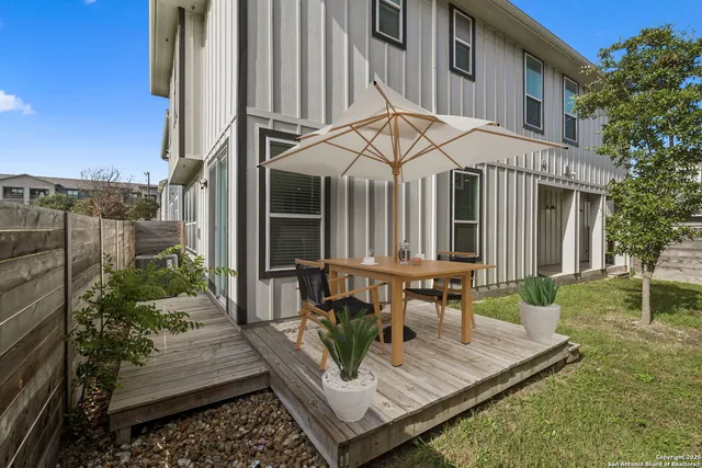 a view of house with a patio