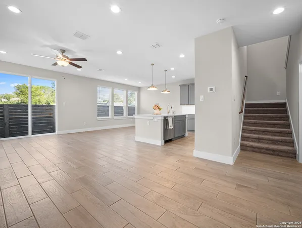 a view of a kitchen with furniture and a window