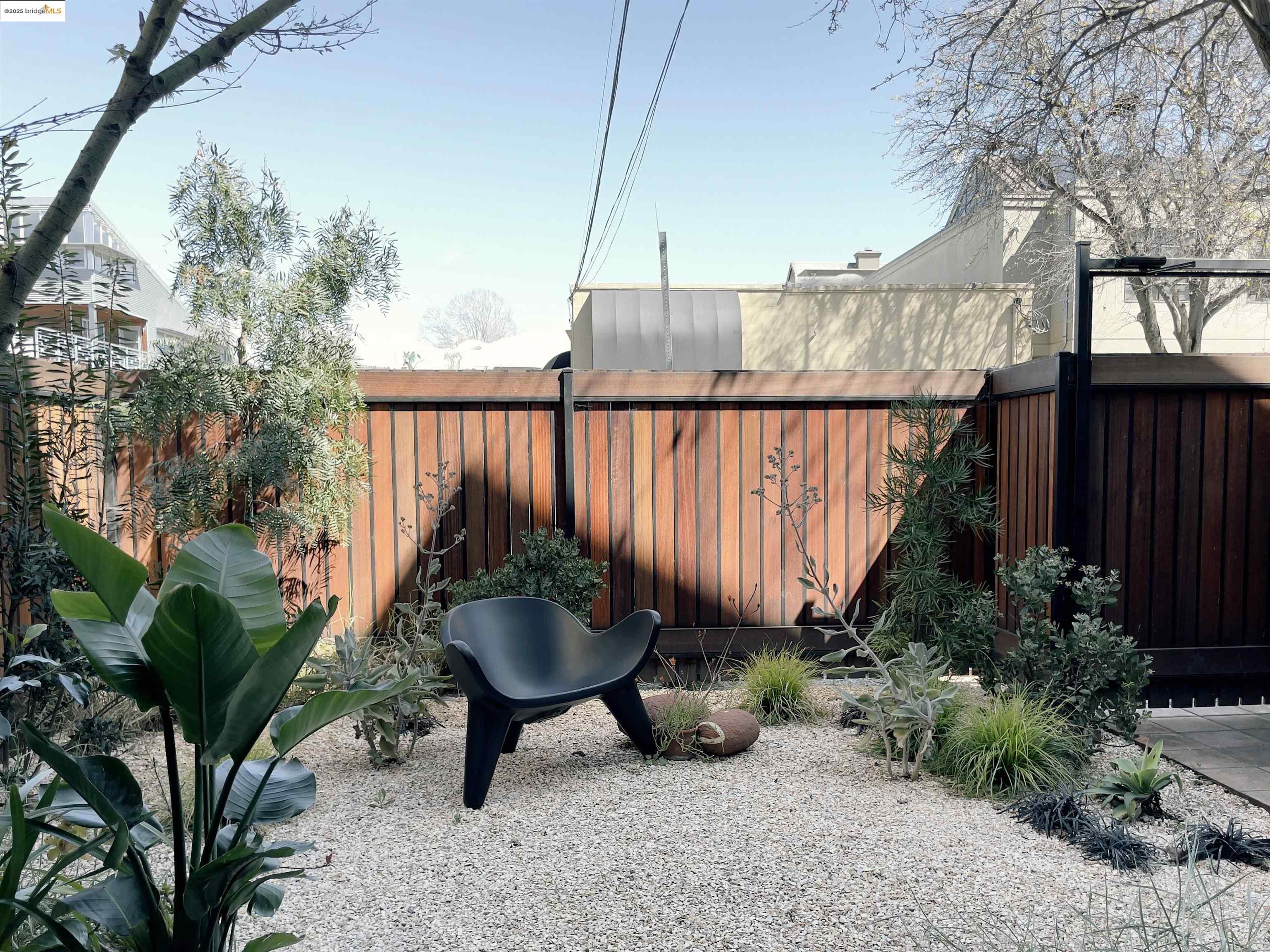 1818 Fifth Street Berkeley, CA 94710 - Photo 20 of 29 a view of a backyard with plants and outdoor seating