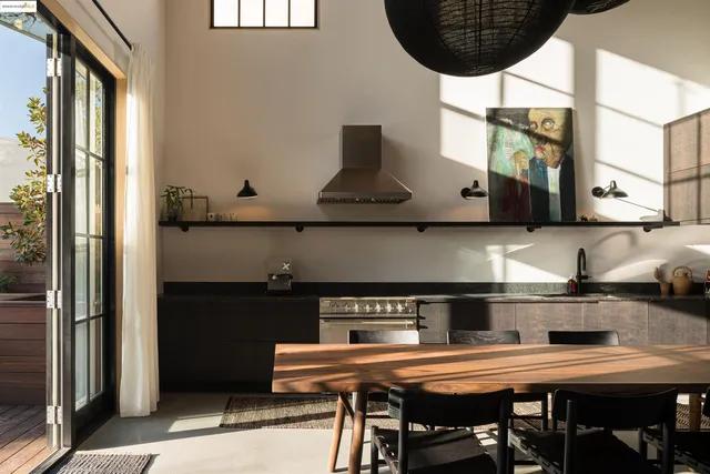 a kitchen with a table and chairs
