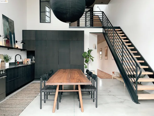 a kitchen with a table and chairs