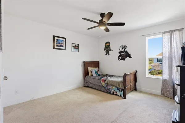 a living room with furniture and flat screen tv