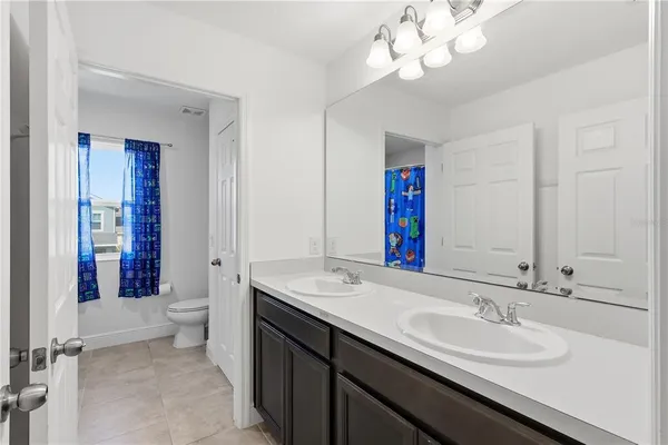 a bathroom with a sink and a toilet