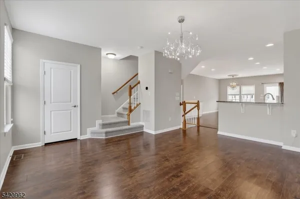 a view of entryway with wooden floor