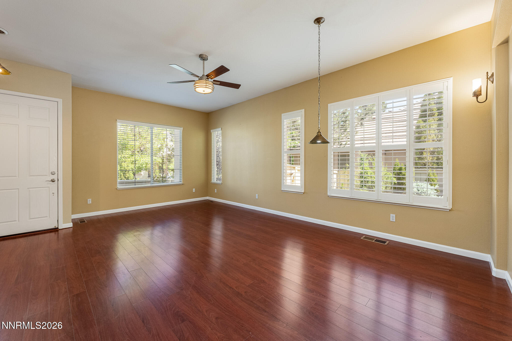 1840 Hunter Creek Road Reno, NV 89519 - Photo 12 of 39 a view of an empty room with wooden floor and a window